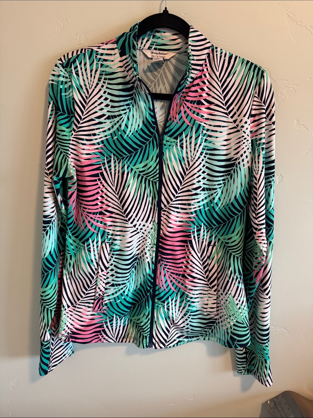 Tommy bahama long sleeve activewear jacket/top. Full zip and two zip  pockets.